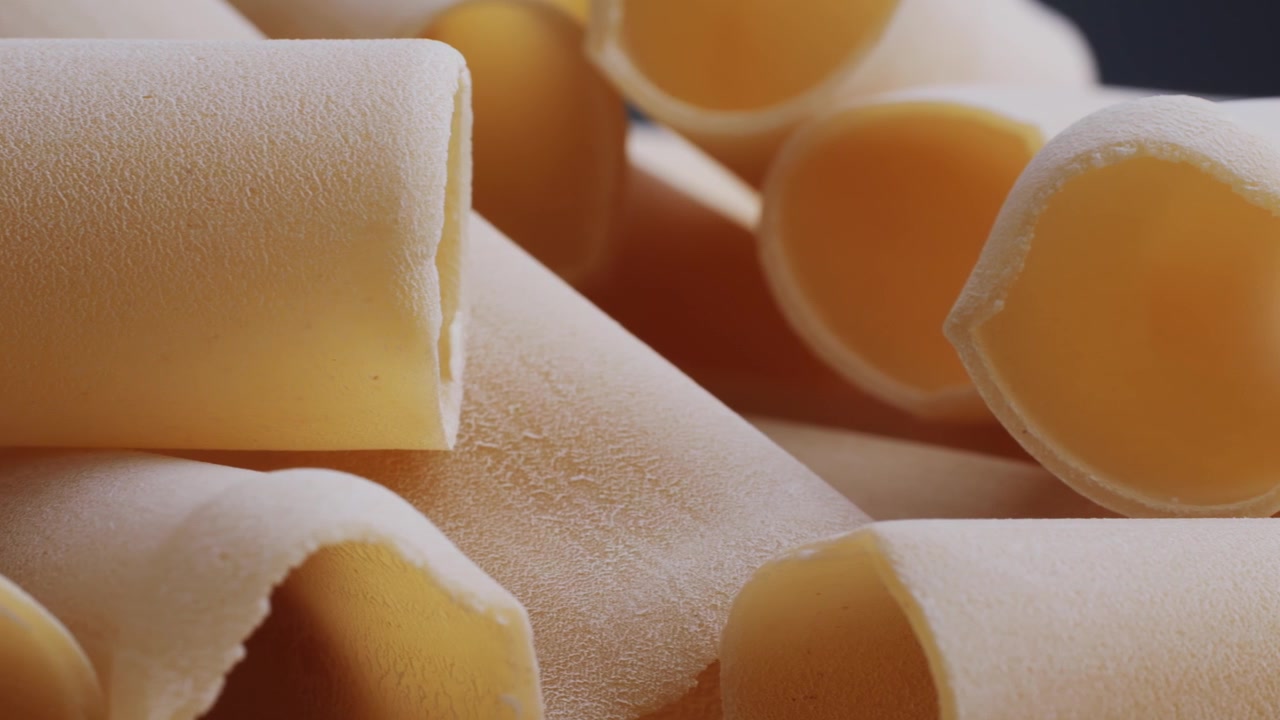 Uncooked Cannelloni Pasta Tubes with Textured Surface