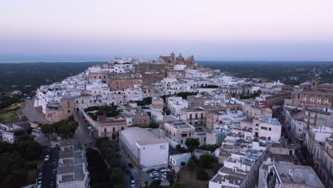 Aerial-drone-footage-of-Ostuni---La-Citta-Bianca-,-Puglia,-Italy-at-sunset