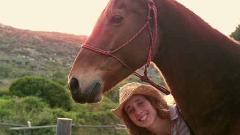 Pretty-woman-petting-a-horse