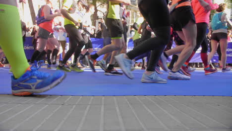 sideway close view on marathon runners legs and shoes sunny day montpellier