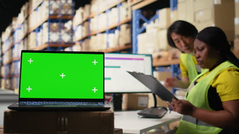 logistics employee organizing packages near isolated mockup on computer
