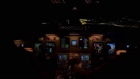 exclusive inner cockpit view during a real night flight during the approach to valencias’s airport, spain