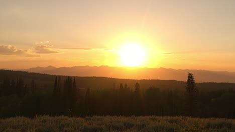 rocky mountain range illuminated by the golden light of the setting sun