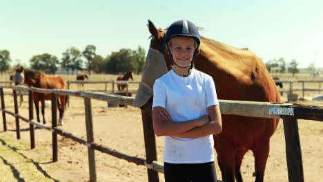 Portrait-of-girl-standing-with-arms-crossed-in-ranch-4k