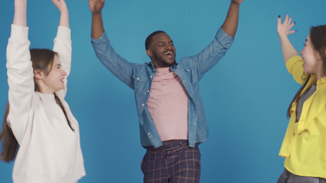 Happy fun and cute three multiracial friends having fun, laughing.