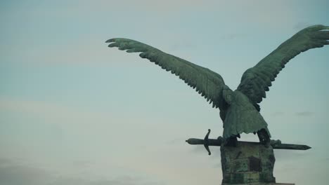 Backside-Of-The-Turul-Statue-In-Budapest-Hungary---panning-close-up