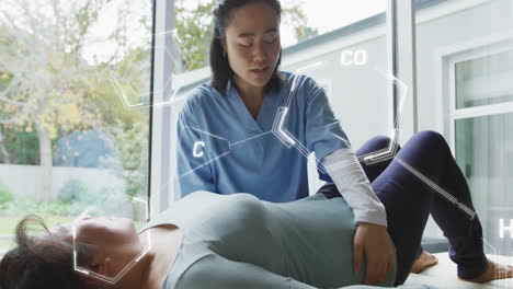 assisting patient, healthcare professional explaining molecular structure overlay in office