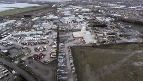 aerial view overlooking uk industrial waterfront refinery factory