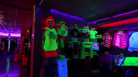 cool mannequin and fluorescent clothing on sale at cyberdog store, camden town. handheld