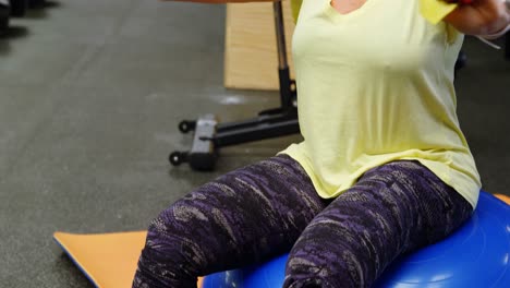 woman doing exercise with resistance band 4k