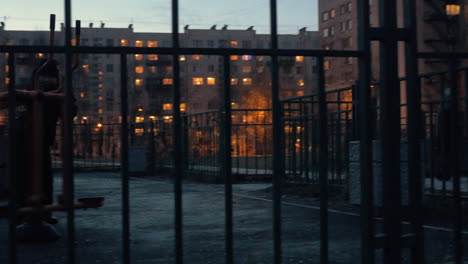 Children-on-the-sports-ground-near-the-house-in-late-evening