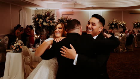 joyful embrace at a wedding reception
