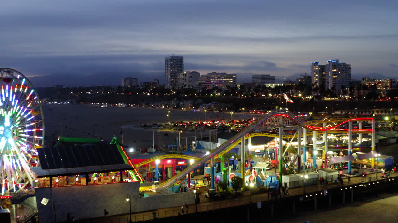 Santa Monica Pier at Night with Ferris Wheel and Roller Coaster