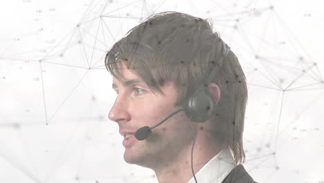 animation of network and data processing over businessman using phone headset, on white