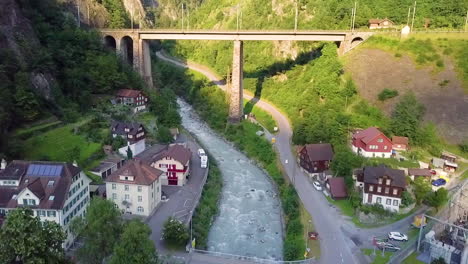 aerial view of river flowing along town houses in lugano, switzerland.