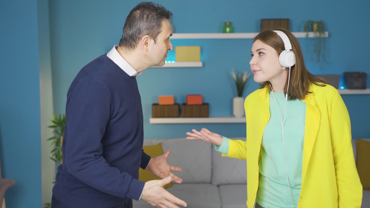 Father and daughter are angry with each other. The girl doesn't want to be involved.