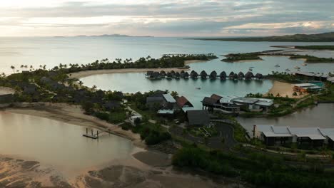 famous marriot resort with luxury overwater bungalows in exotic lagoon, aerial