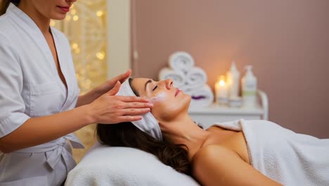 a rejuvenating facial treatment session enhancing skin care and relaxation with gentle massage techniques to promote radiant beauty for the client