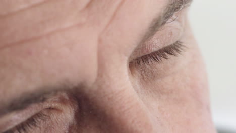 close up mature man eyes looking around eyesight macro