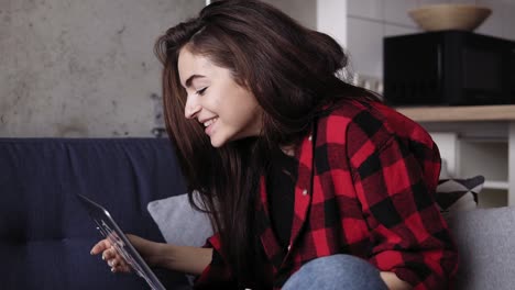 Young-attractive-girl-being-extra-emotional-while-video-chatting-with-someone.