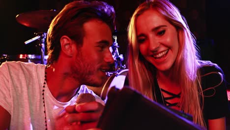 couple interacting with each other while using digital tablet 4k