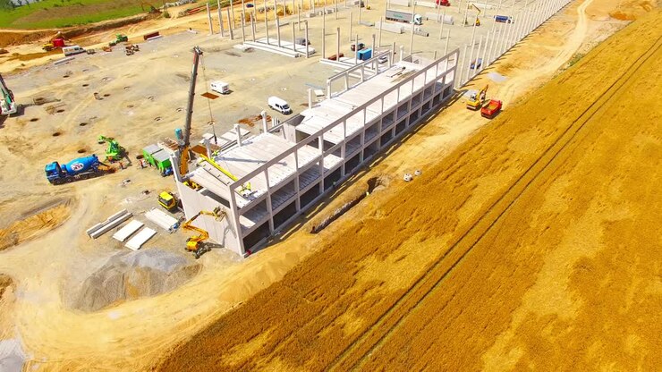 Aerial view of construction site. Industrial theme from drone. Industry, development and investment in European Union.
