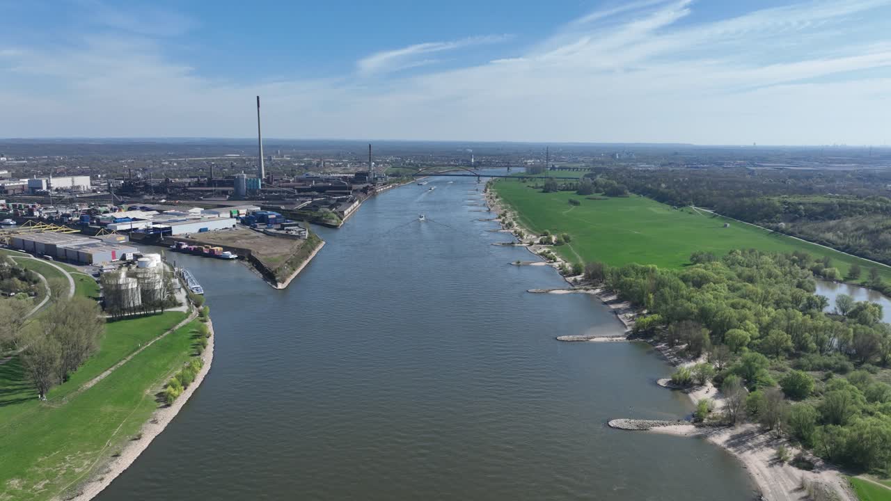 Rhine river, industrial ruhr region, shipping waterway for industrial transport. Infrastructure, Trade and industry in Germany. Aerial view.