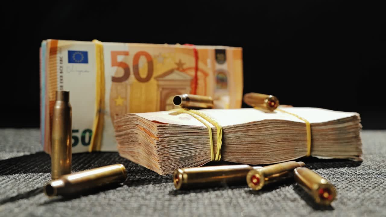 Euro banknotes and brass shells symbolizing blood money and war finance
