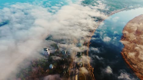 lielupe river curves through jūrmala under dense fog, bright sea reflections
