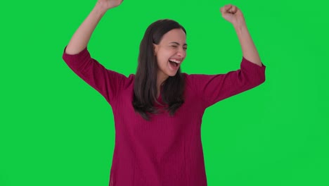 happy indian woman dancing and enjoying green screen