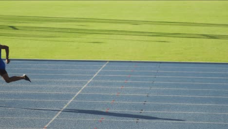 two athletes running in stadium