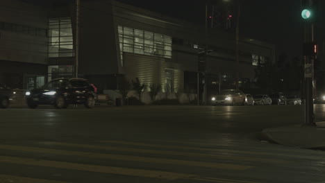 static shot of a police station with traffic moving in both directions infront