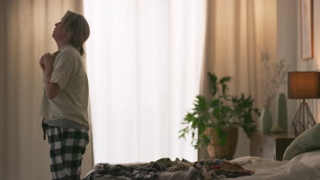 woman in pajamas in bedroom
