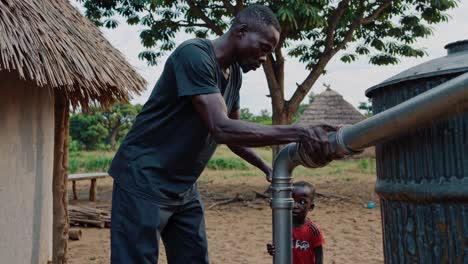 african technician carefully connecting pipes to a water tank, implementing a rainwater harvesting system in a rural village, while a child observes