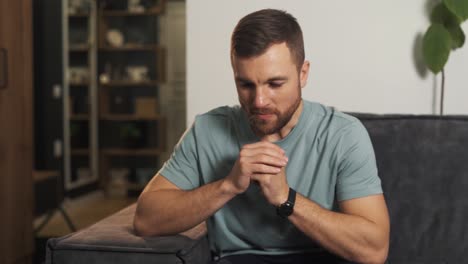 worried excited man alone with himself trying to focus and take control of himself