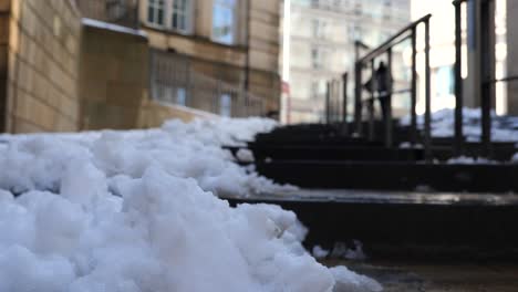Snowy,-frozen-steps-outside,-person-approaches-and-descends,-Sheffield