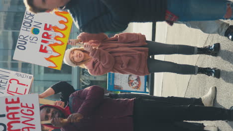 Vertical-Video-Of-Protestors-With-Placards-Chanting-Slogans-On-Climate-Change-Demonstration