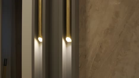 abstract play of light and shadow featuring modern vertical lighting against textured walls, creating a warm ambience