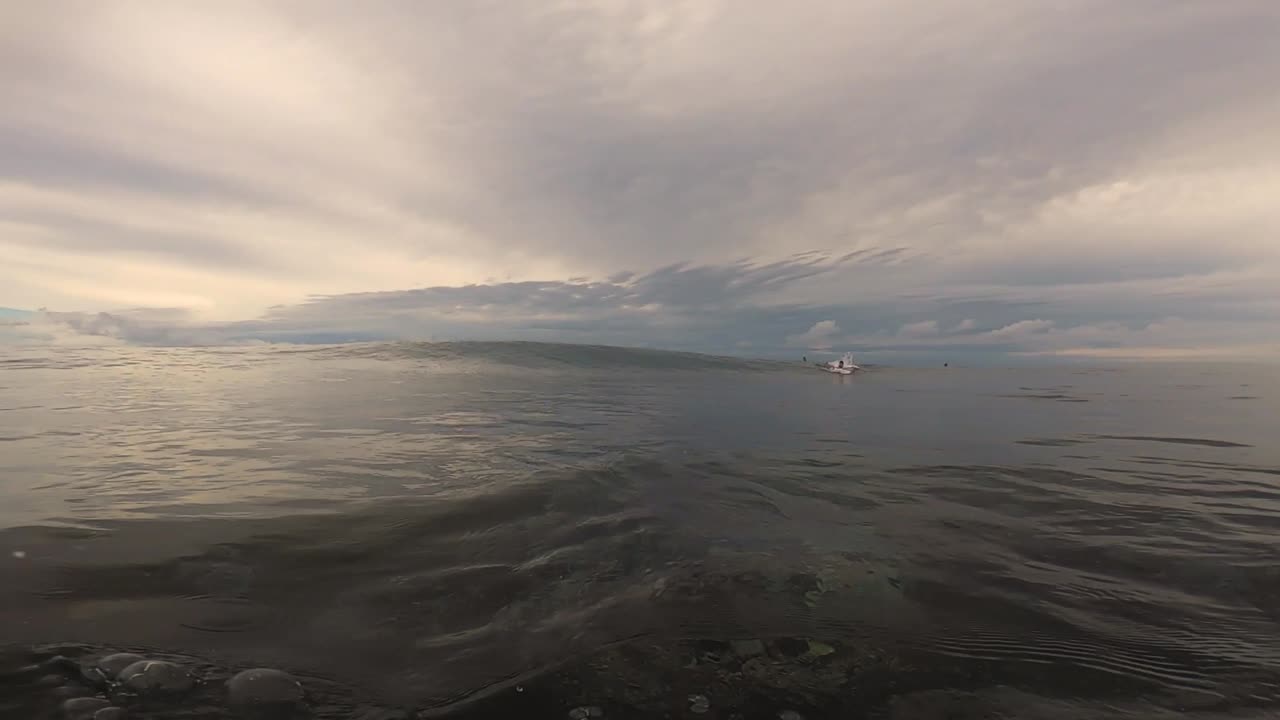 Epic Surfing Waves: A Barrel Ride at Sunset