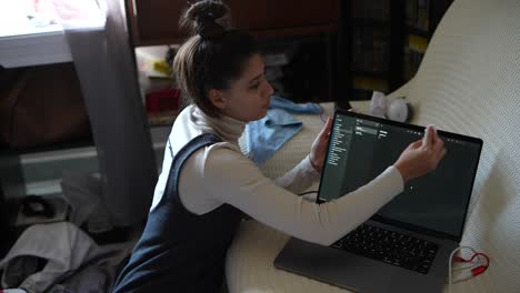Woman working on a laptop at home