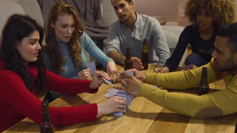 millennial adult friends socialising together at home