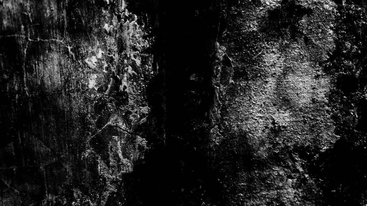 Textura de parede de concreto escura, rústica, preta e branca.