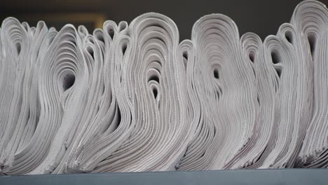 close-up of a stack of rolled-up newspapers