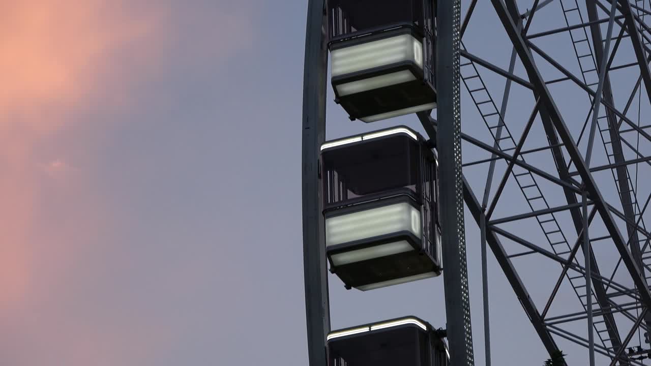 4K. The Budapest Eye ferris wheel is turning. It is getting dark