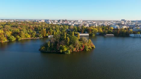 rotating aerial view over lake herastrau in autumn, bucharest, romania