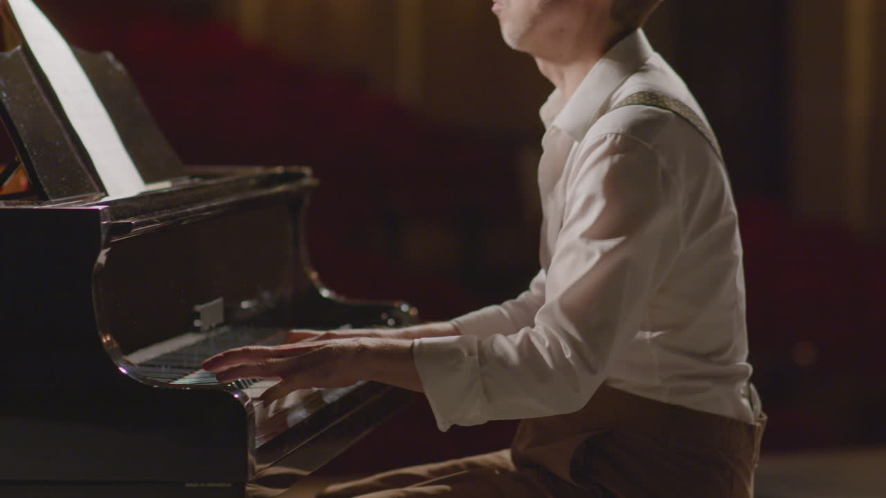 Pianist Playing Music on Stage with Enjoyment