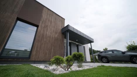 modern exterior of the house. house with its own territory and large panoramic windows. a small suburban house in a modern style.