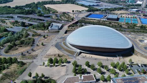 London-Aquatics-centre-futuristic-attraction-architecture,-Stratford-landmark-aerial-view