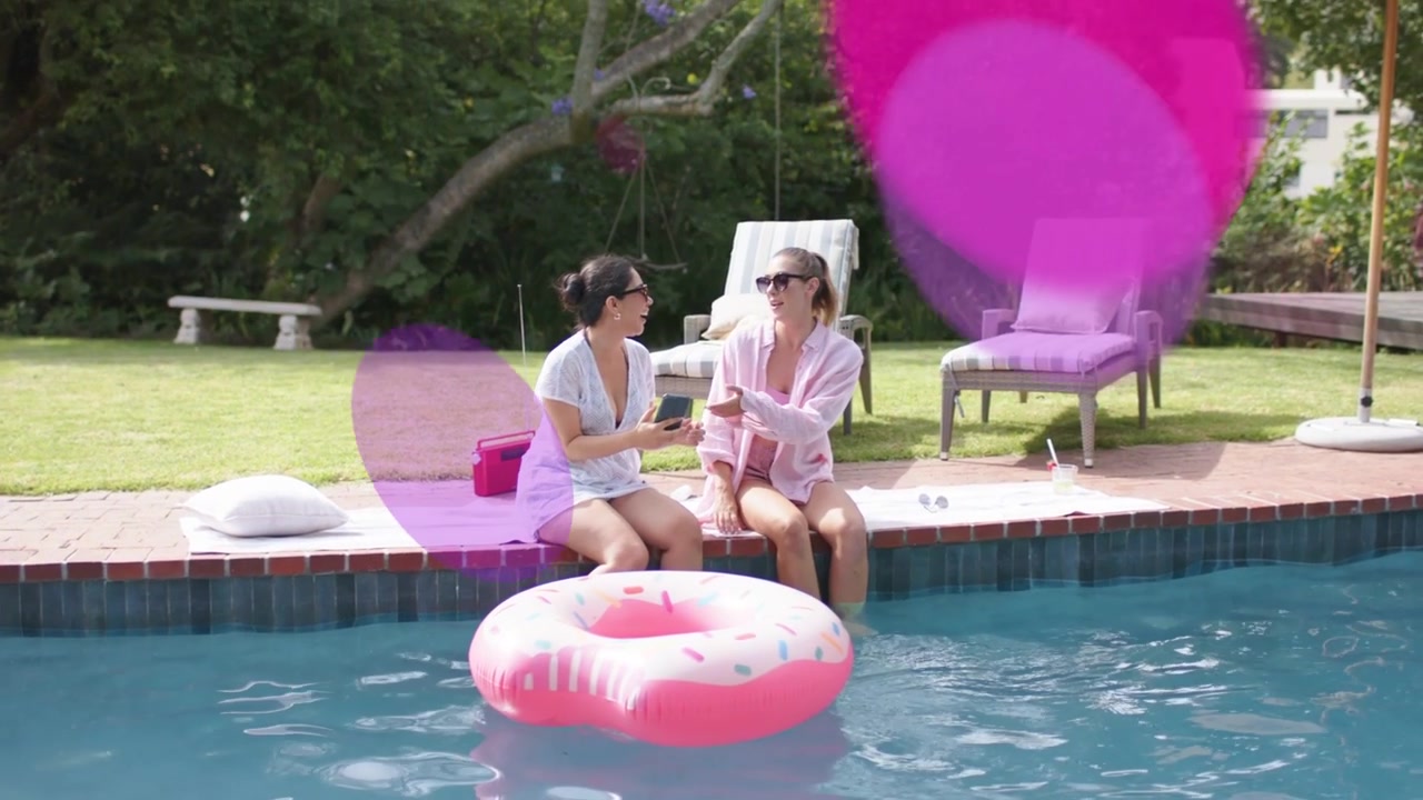 Left woman showing phone to friend at pool, activating pink overlays and guiding marketing review