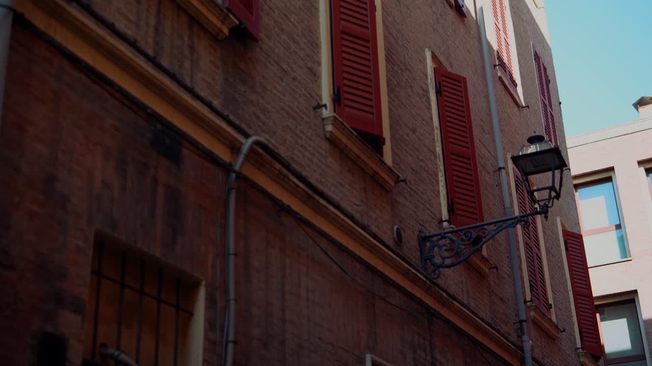Old Building with Red Shutters and Modern Architecture